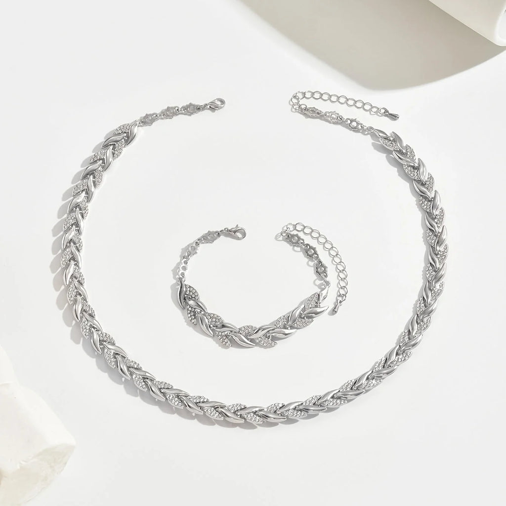 Full rhinestone chain jewellery set in rose gold tone with necklace and bracelet displayed together