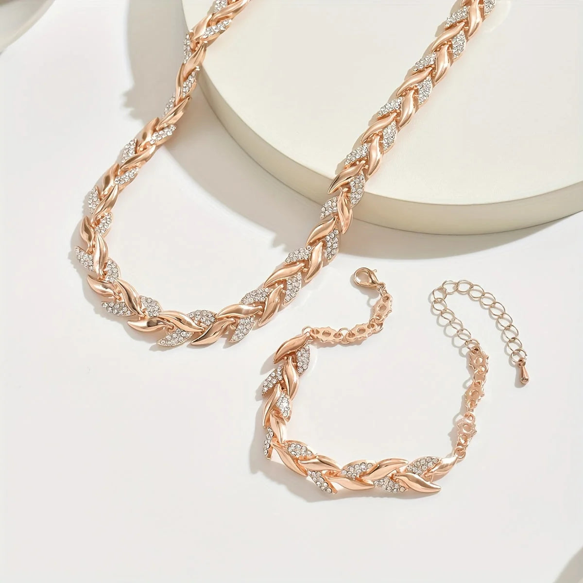Rhinestone chain jewellery set in silver tone displayed on neutral background