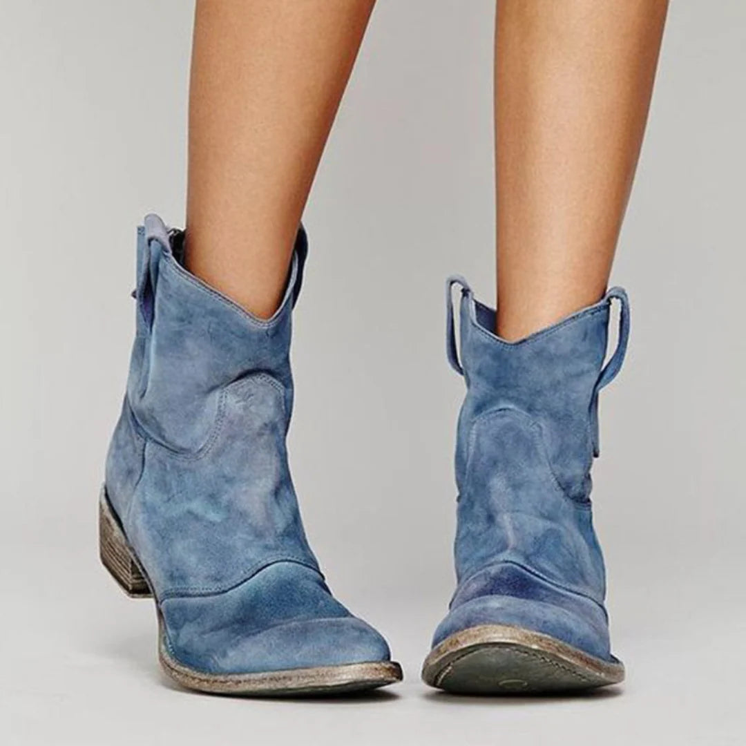 Women's ankle boots with low stacked heel and relaxed western-inspired silhouette
