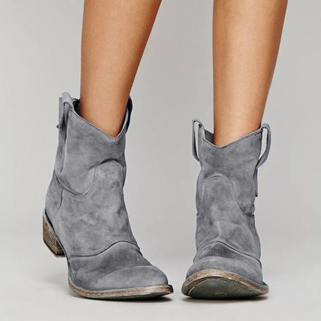 Full view of women's western pull tab ankle boots with ankle-height shaft and structured design