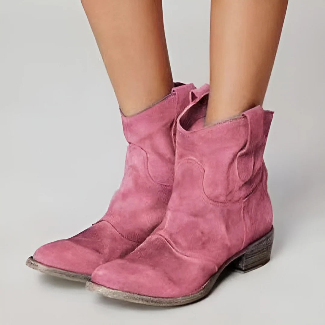 Women's ankle boots showcasing western-inspired details and low block heel profile