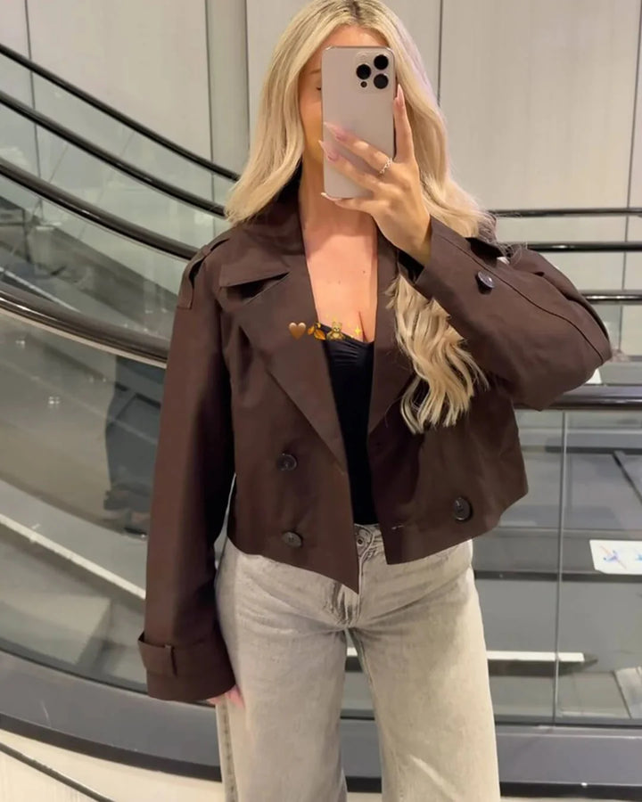 Full-length view of women's cropped trench jacket with relaxed fit through body