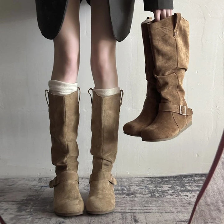 Women's knee-high slouch boots in tan suede-effect finish with buckle strap and flat sole