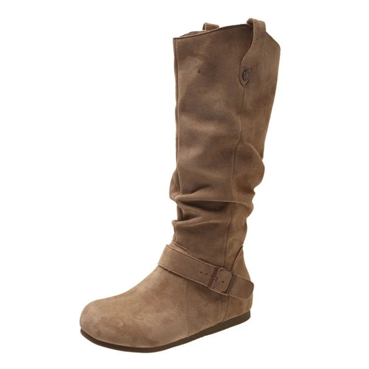 Women's knee-high slouch boots worn with black leggings showing roomy fit and comfortable styling