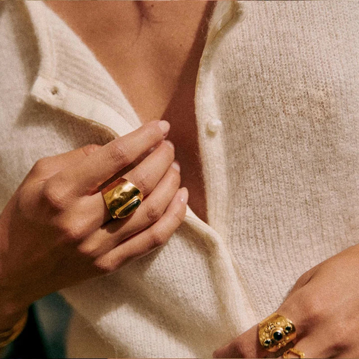 Close-up of V-neckline and button detail on ivory mohair top cardigan