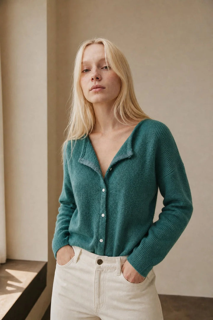 Woman styling mohair top cardigan over tailored trousers for a smart-casual look