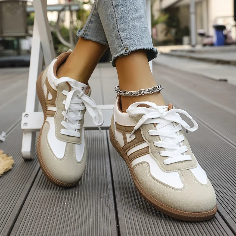 Rear view of women's wide-toe trainers displaying supportive heel counter and gum-tone sole