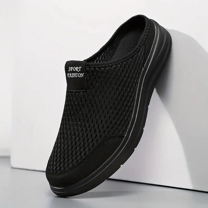 Men's slip-on mesh trainers in black with cushioned sole and breathable upper for casual wear