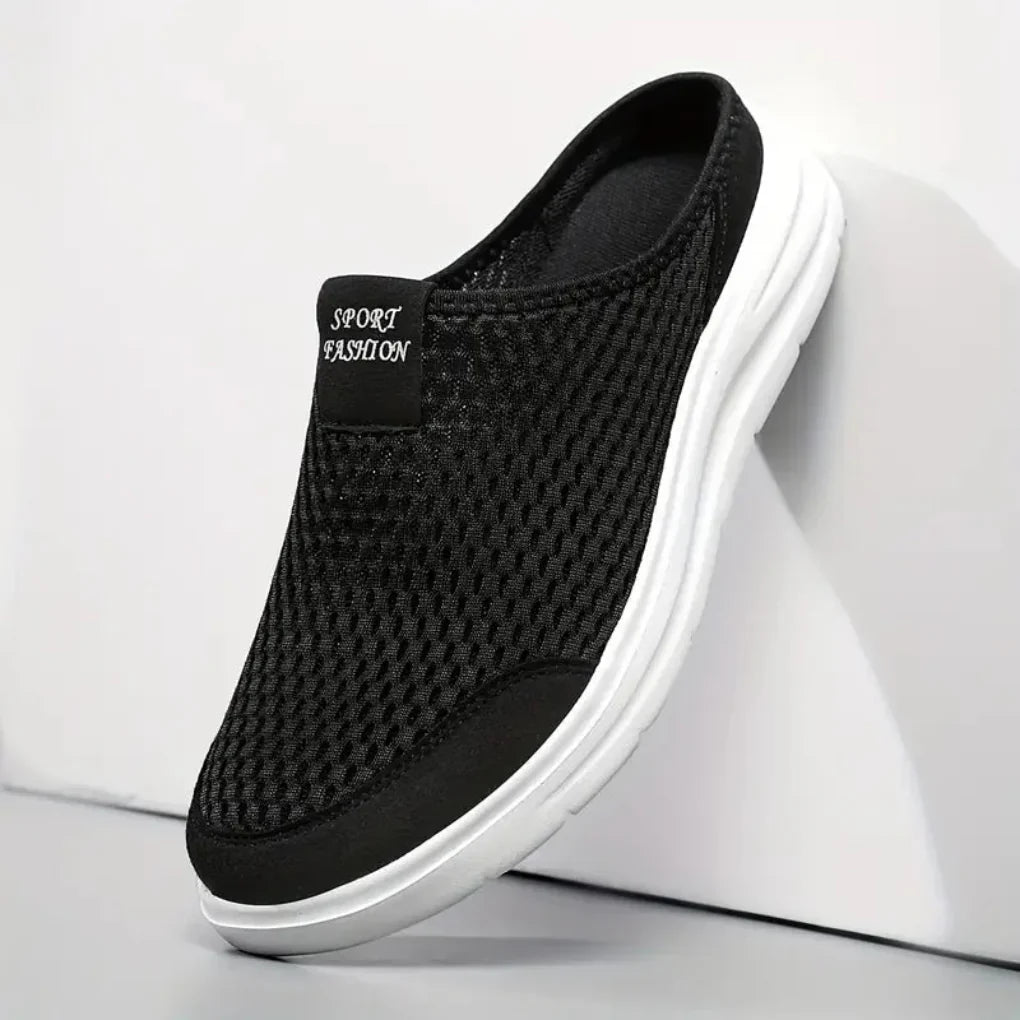 Side view of men's slip-on mesh trainers showing breathable construction and grippy rubber sole