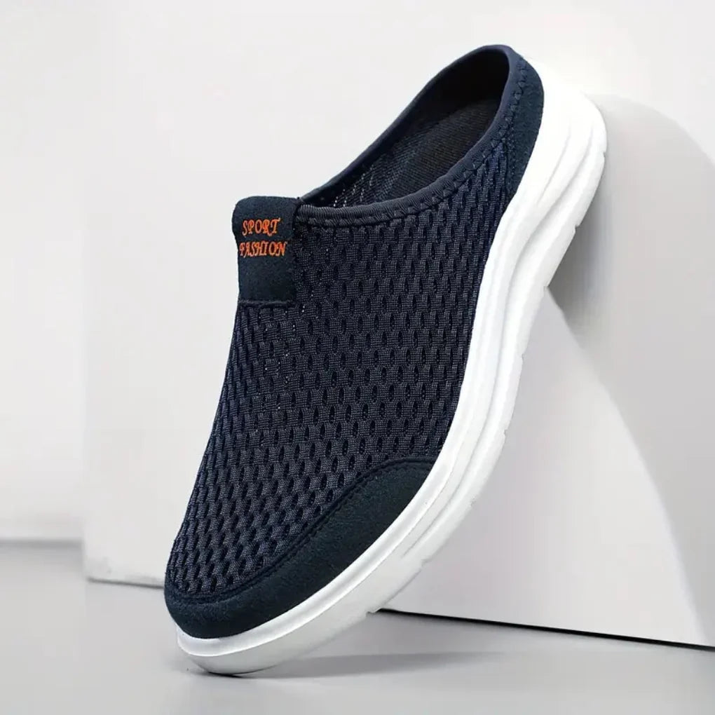 Men's slip-on mesh trainers in black featuring easy pull-on design and cushioned footbed