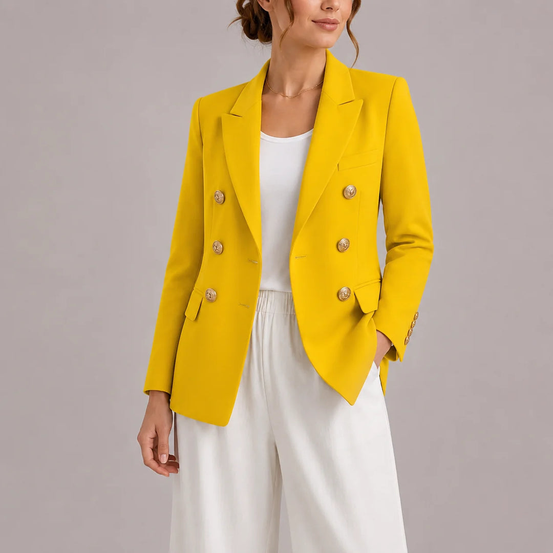 Detail shot of blazer sleeve cuff with decorative gold buttons
