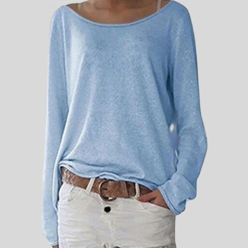 Close-up view of women's knit long sleeve top showing soft fabric texture and round neckline