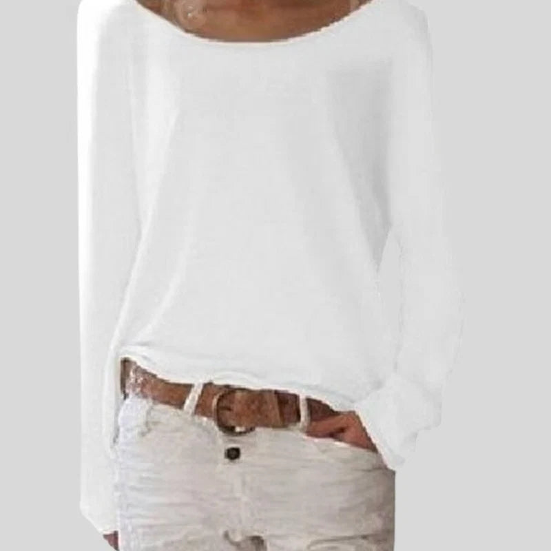 Detail of women's knit long sleeve top showing straight hem and relaxed drape