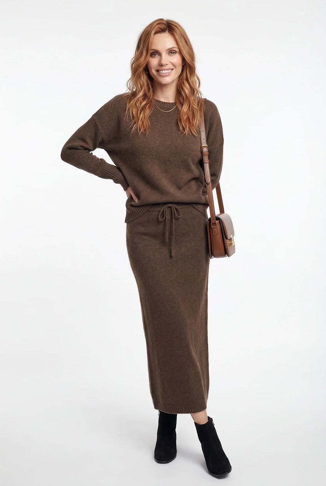 Detail of structured knit fabric texture on jumper and matching skirt