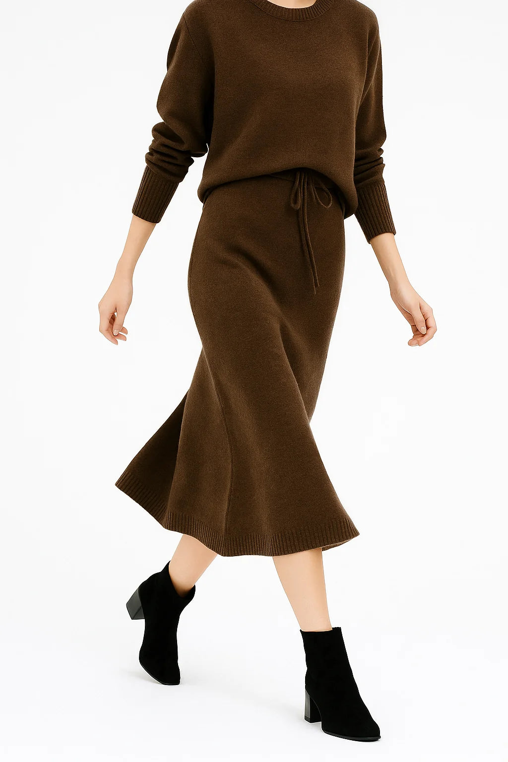 Side angle of midi knit skirt showing straight silhouette and ribbed waistband detail