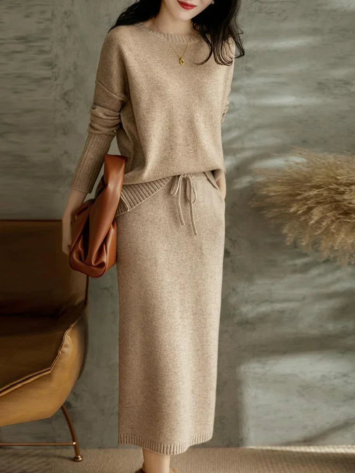 Model wearing taupe knitted co-ord set styled for cool weather occasions
