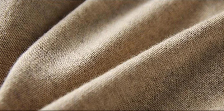 Detail of crew neckline with ribbed trim on relaxed knitted jumper