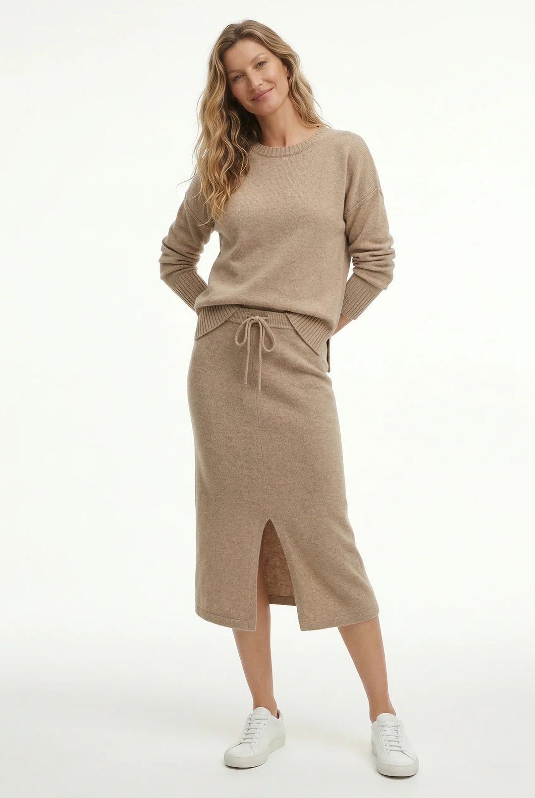 Women's knitted co-ord set in taupe displayed on neutral background showing coordinated design