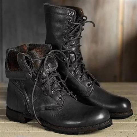 Side view of women's brown mid-calf lace-up boots showing structured shaft and low heel