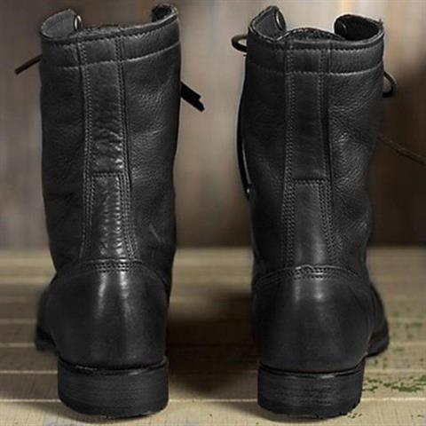 Pair of women's brown lace-up mid-calf boots with rounded toe and visible tread sole