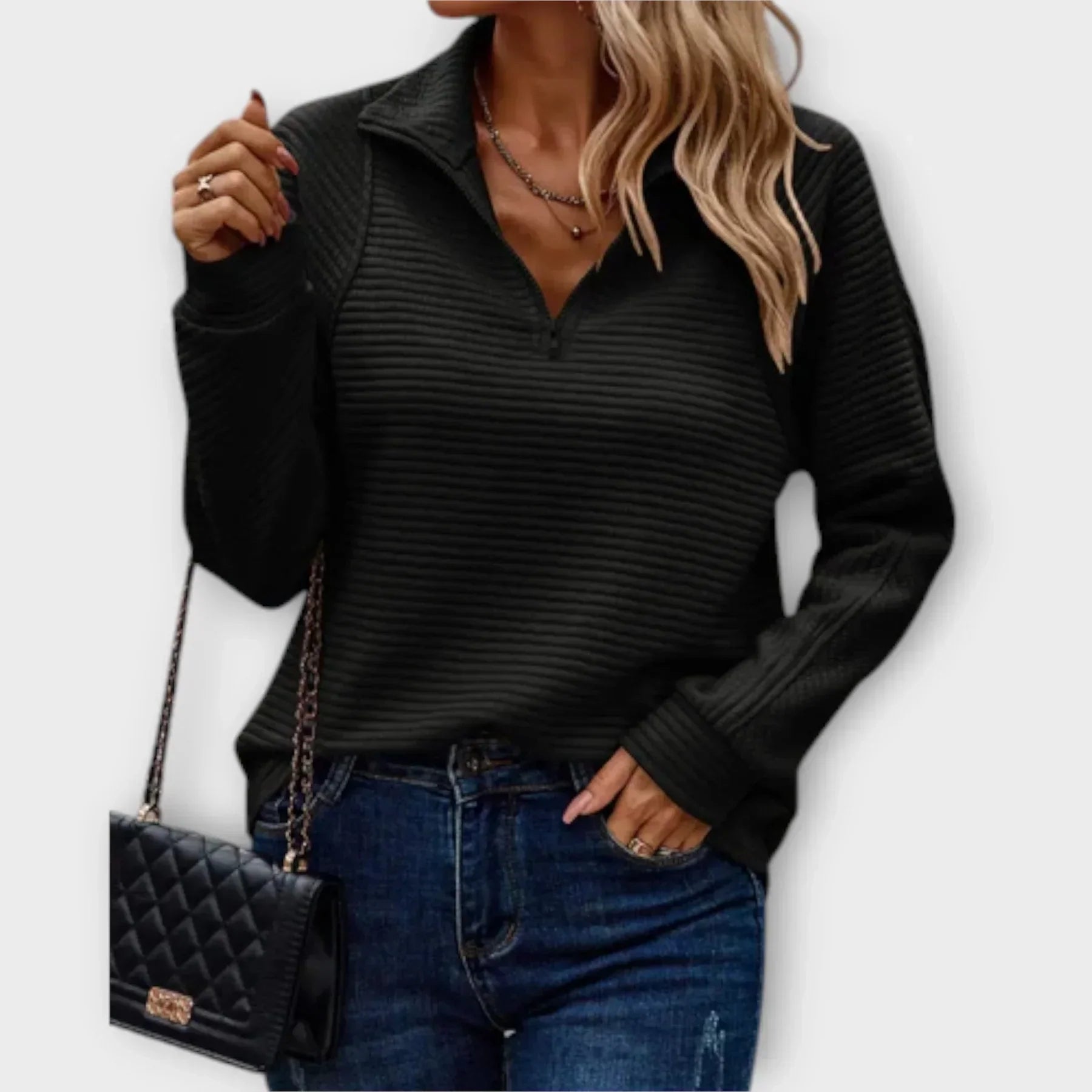 Women's pink ribbed jumper styled with denim for casual everyday wear