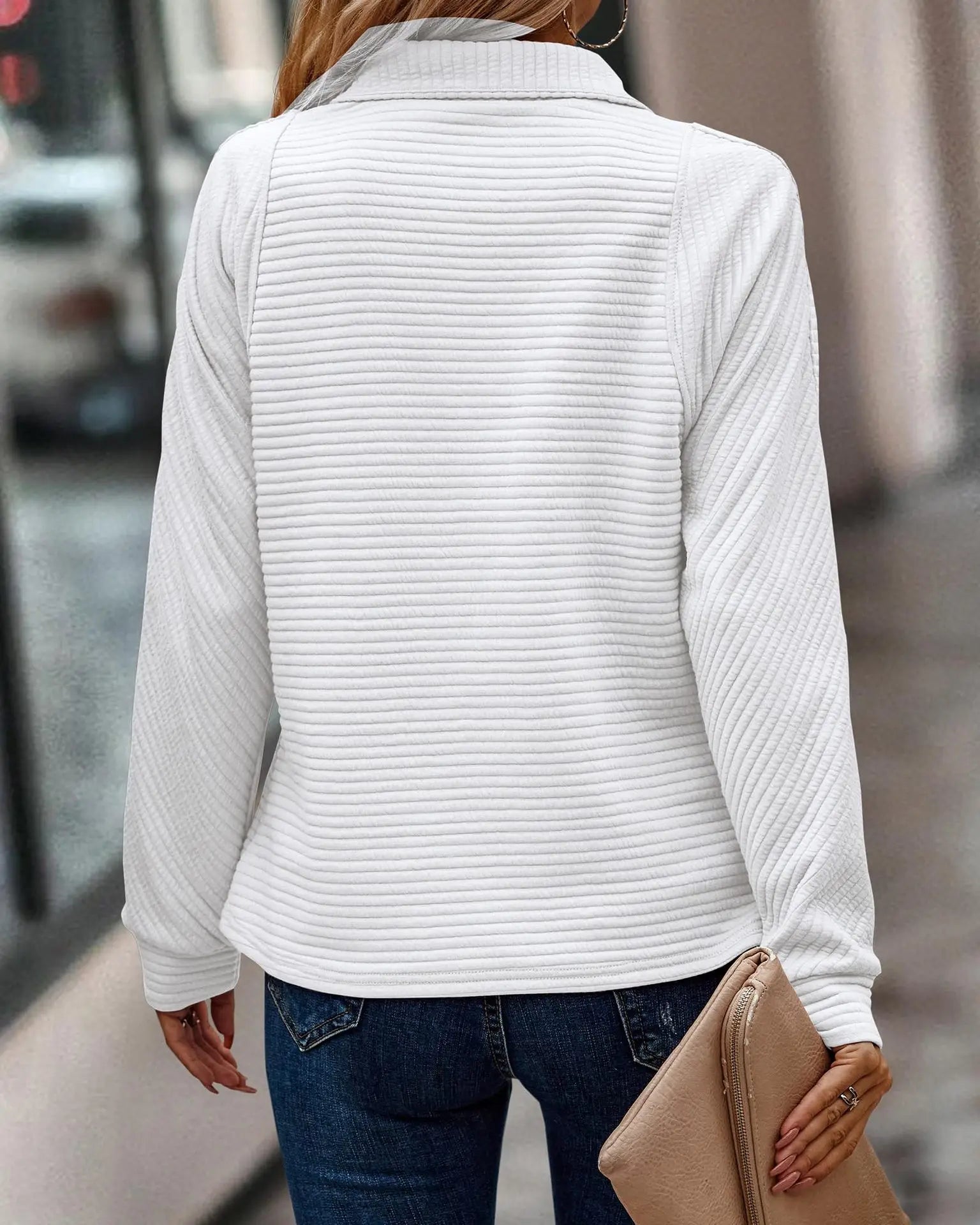 Ribbed half zip jumper in dusty pink showing stand collar and zip detail