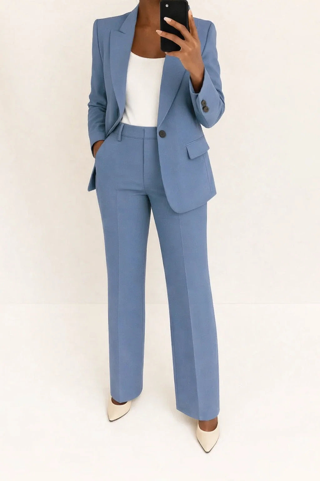 Women's tailored blazer and wide-leg trouser set in dusty blue woven fabric with single-button closure and notched lapels