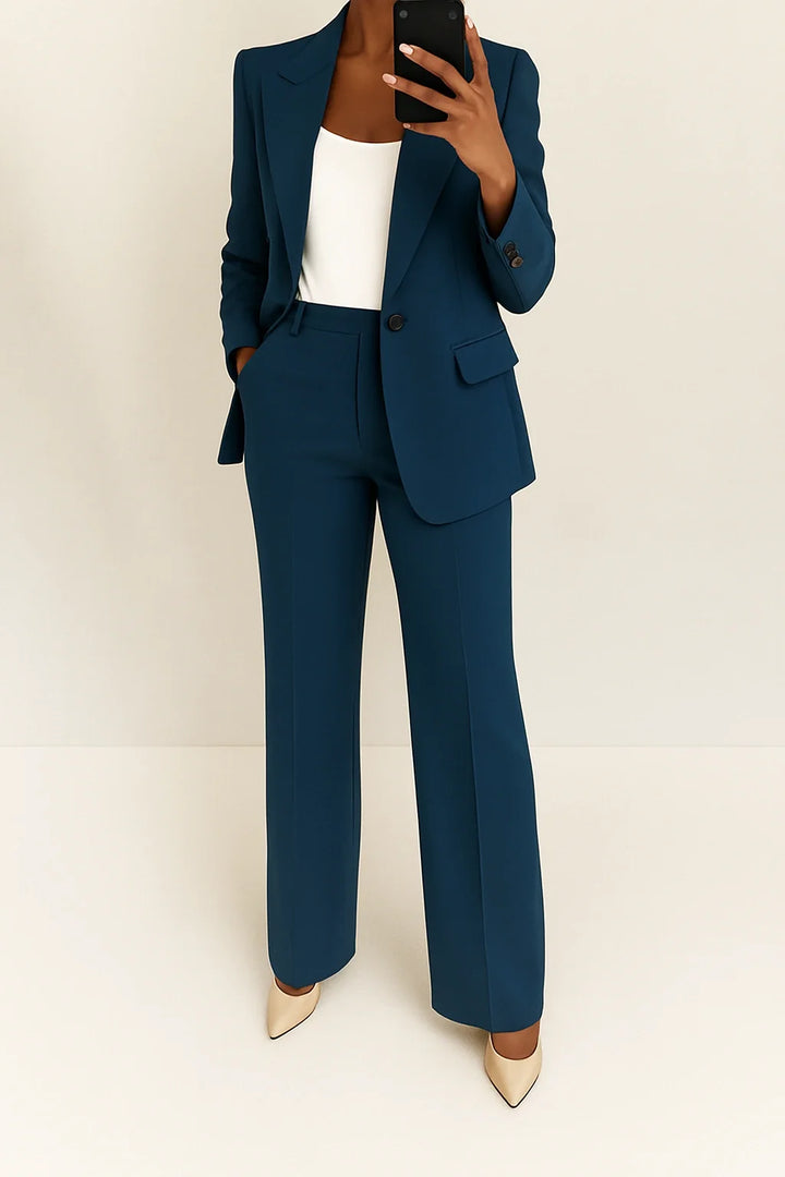Women's co-ord set in dusty blue featuring single-button blazer and high-waist wide-leg trousers