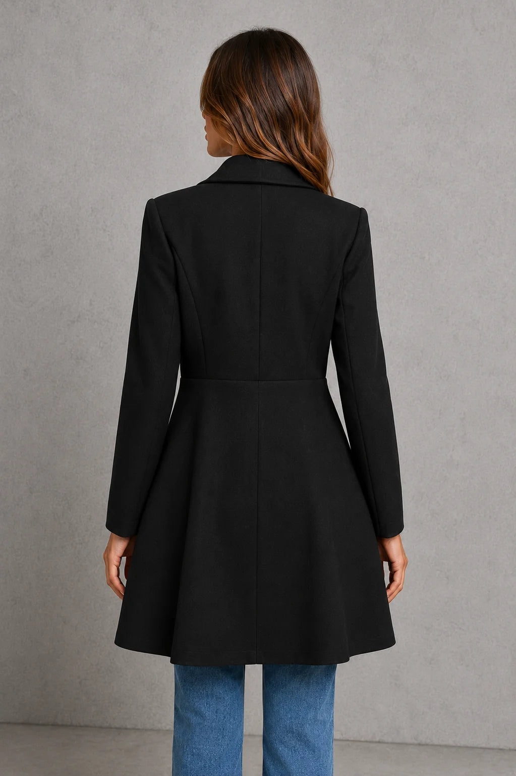 Black tailored longline coat with double-breasted detailing and structured fit