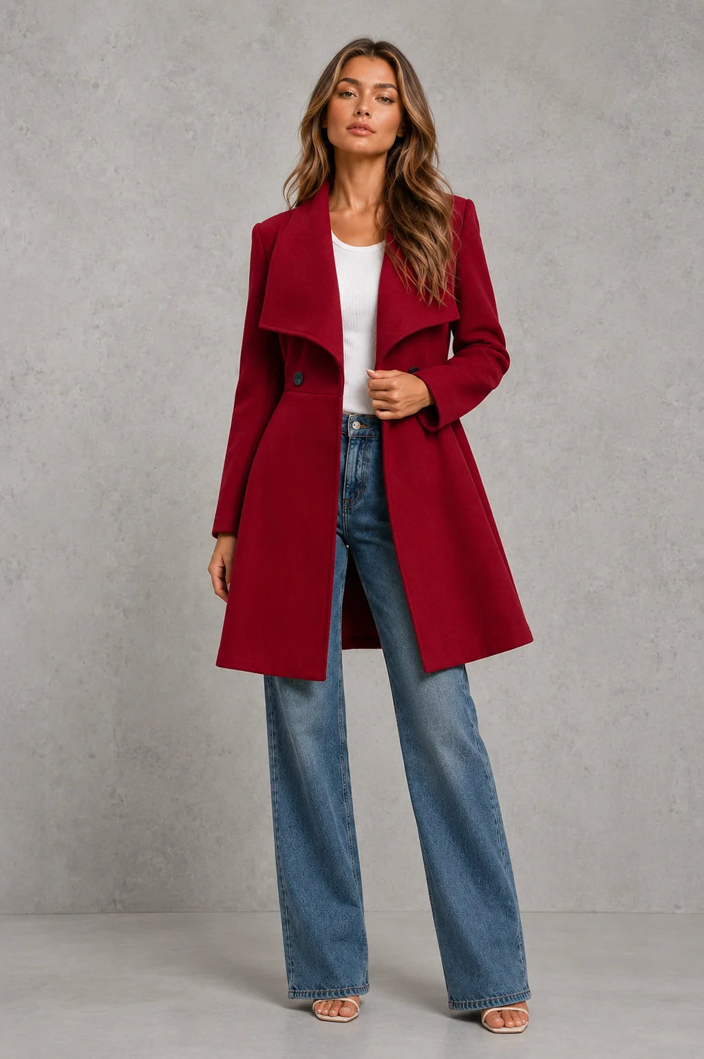 Women's burgundy tailored coat styled with casual separates for autumn layering