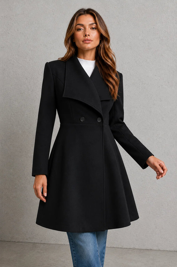 Back view of tailored coat showing clean lines and longline silhouette
