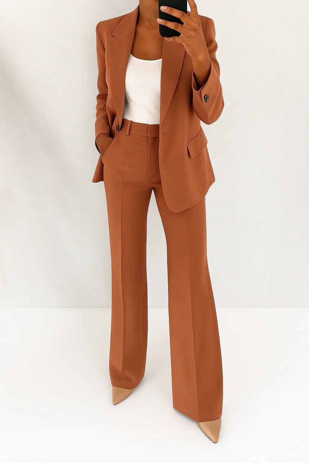 Detail of tailored blazer showing structured shoulders and defined waist