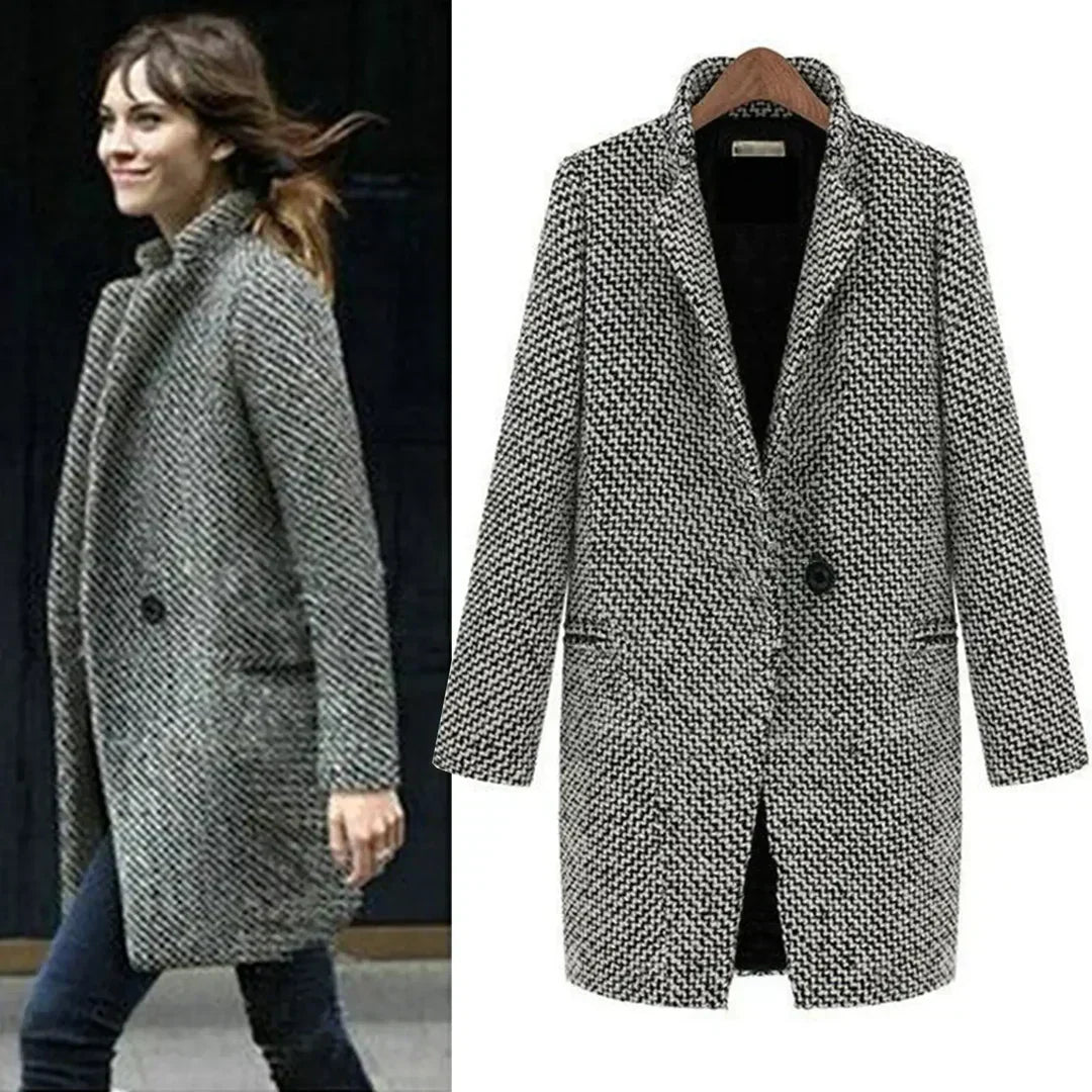 Close-up view of the textured woven fabric and relaxed fit of the longline coat