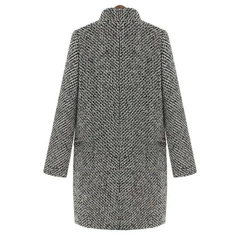 Detail of the V-neckline and single-button closure on the textured longline coat