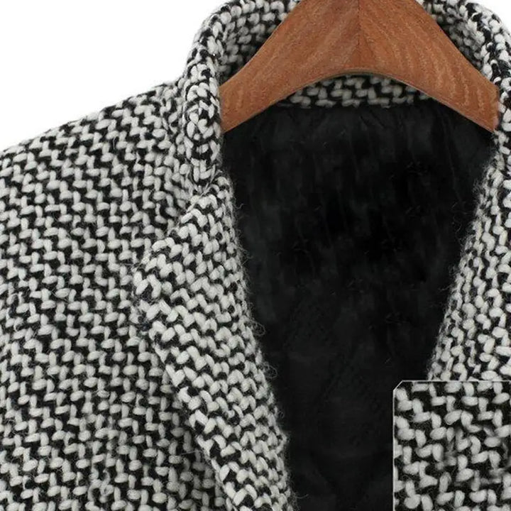 Full-length view of the women's textured coat styled with casual winter layers