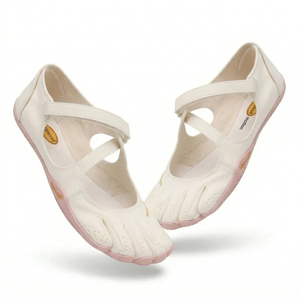 Close-up view of grey barefoot five toe shoes showing adjustable hook-and-loop strap closure
