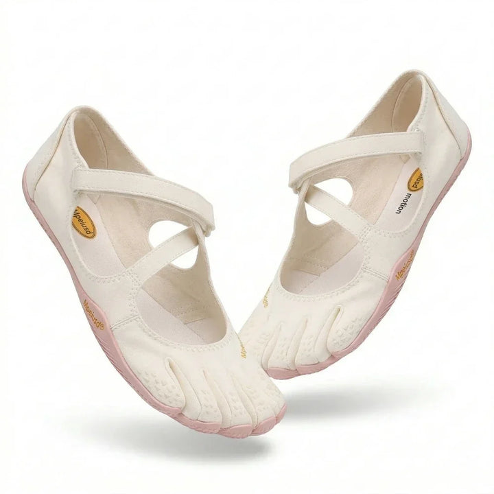 Close-up view of grey barefoot five toe shoes showing adjustable hook-and-loop strap closure