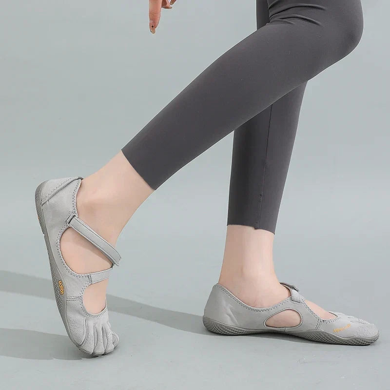 Detail of barefoot shoe construction with stretch knit fabric and adjustable fastening