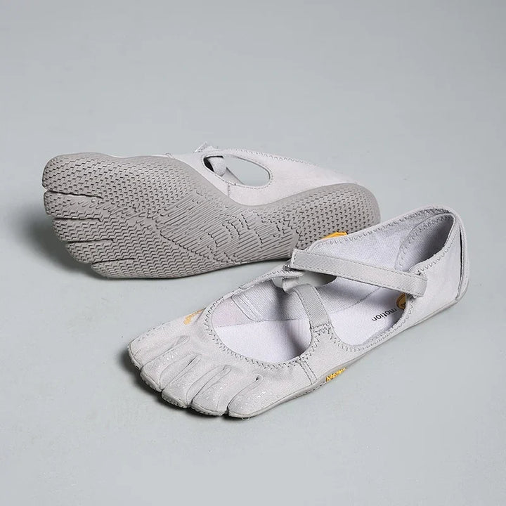 Grey barefoot trainers with individual toe compartments and secure cross strap closure