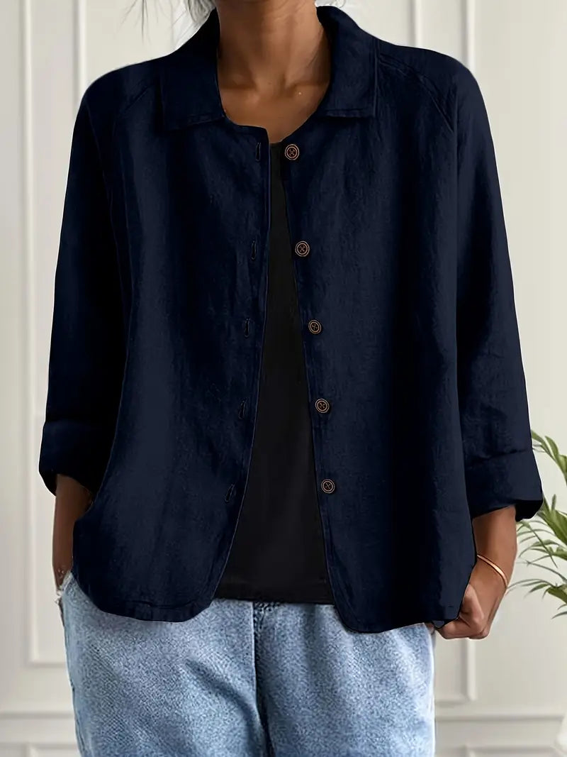 Women's button-front shirt in light blue showing textured fabric and relaxed silhouette