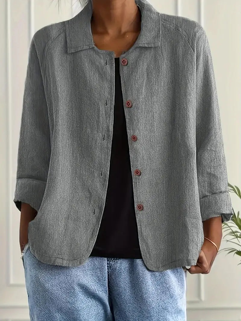 Back view of women's relaxed button-front shirt showing natural drape and hip-length cut