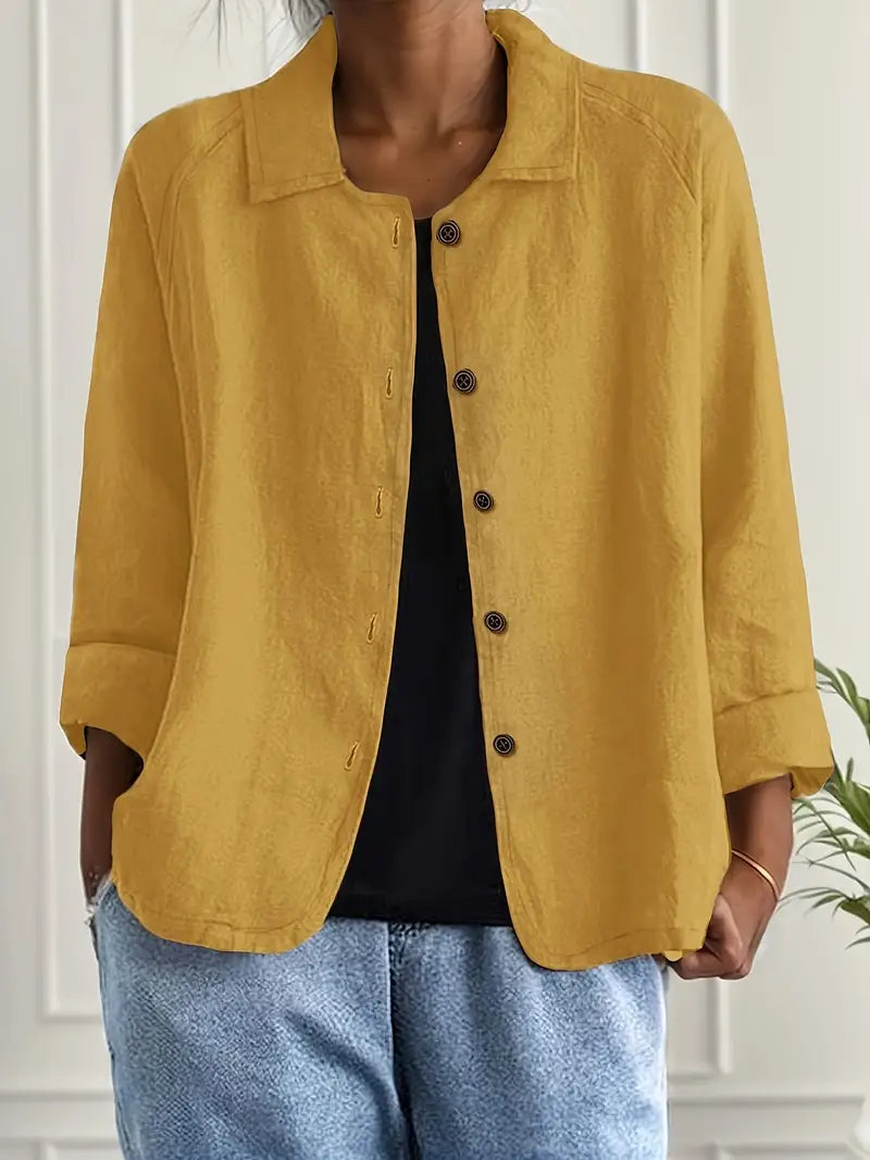 Three-quarter sleeve detail with rolled cuffs on women's button-front shirt