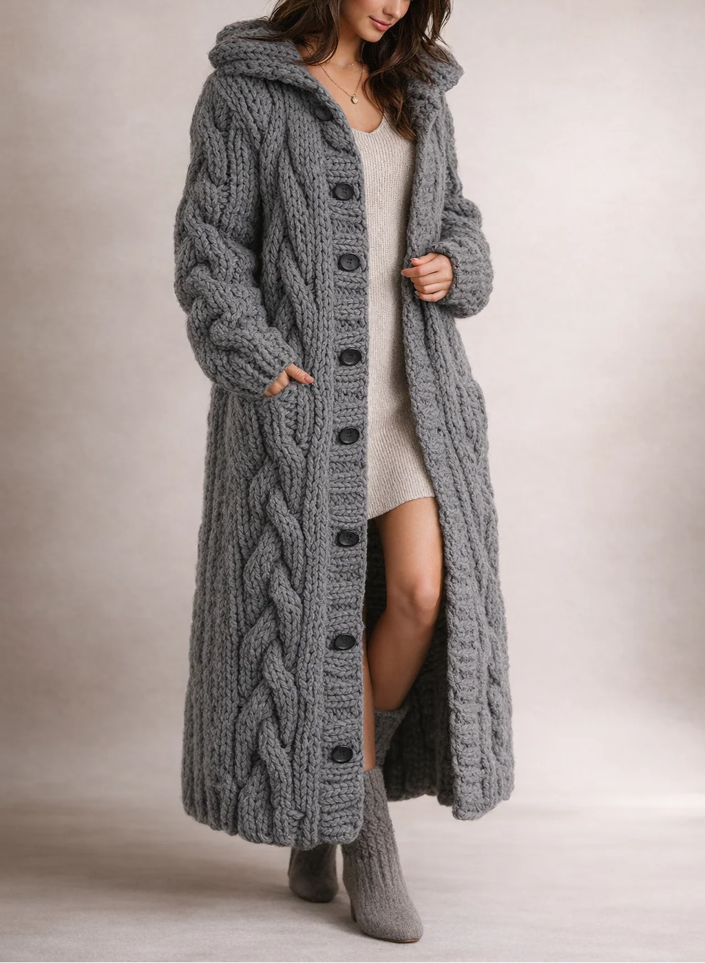 Women's cable knit long hooded cardigan in grey with button-through front and side pockets