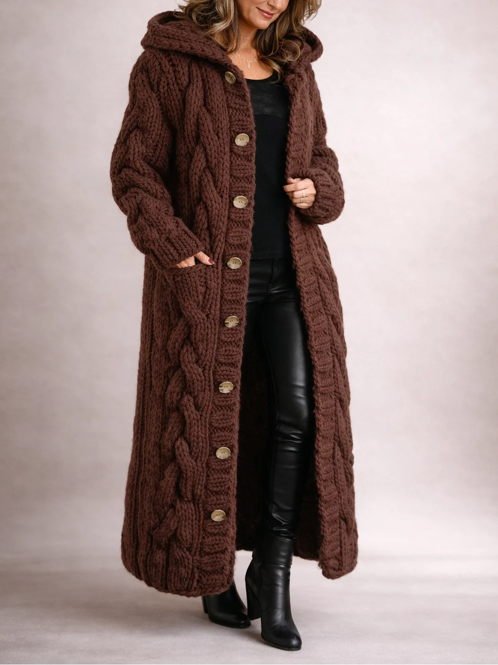 Side view of oversized hooded cardigan showing full-length drape and pocket placement