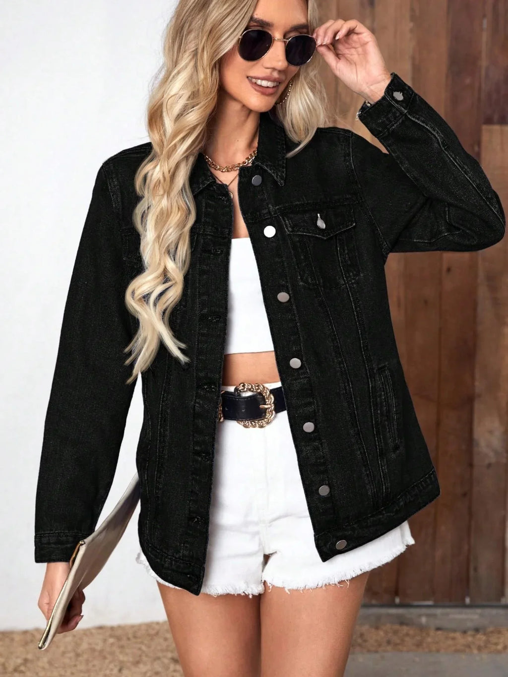 Back view of women's denim jacket showing structured silhouette and contrast stitching