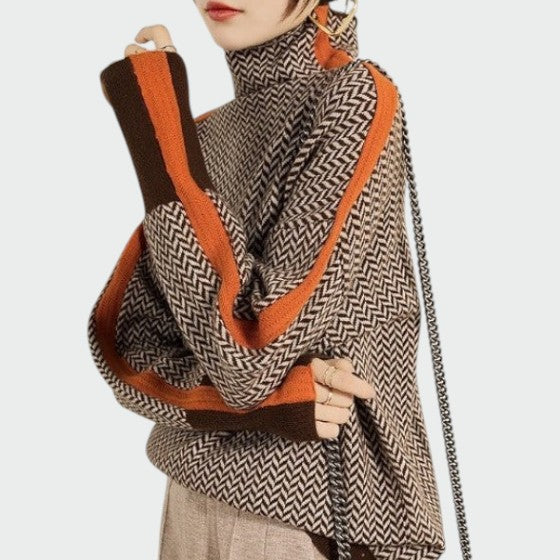 Women's herringbone turtleneck jumper with contrast orange stripe detail and textured chevron pattern