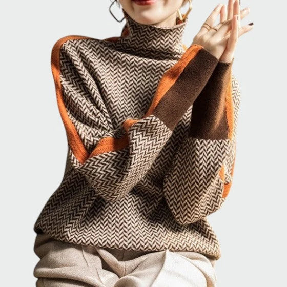 Side angle of relaxed fit herringbone jumper with contrast stripe on shoulder and sleeve