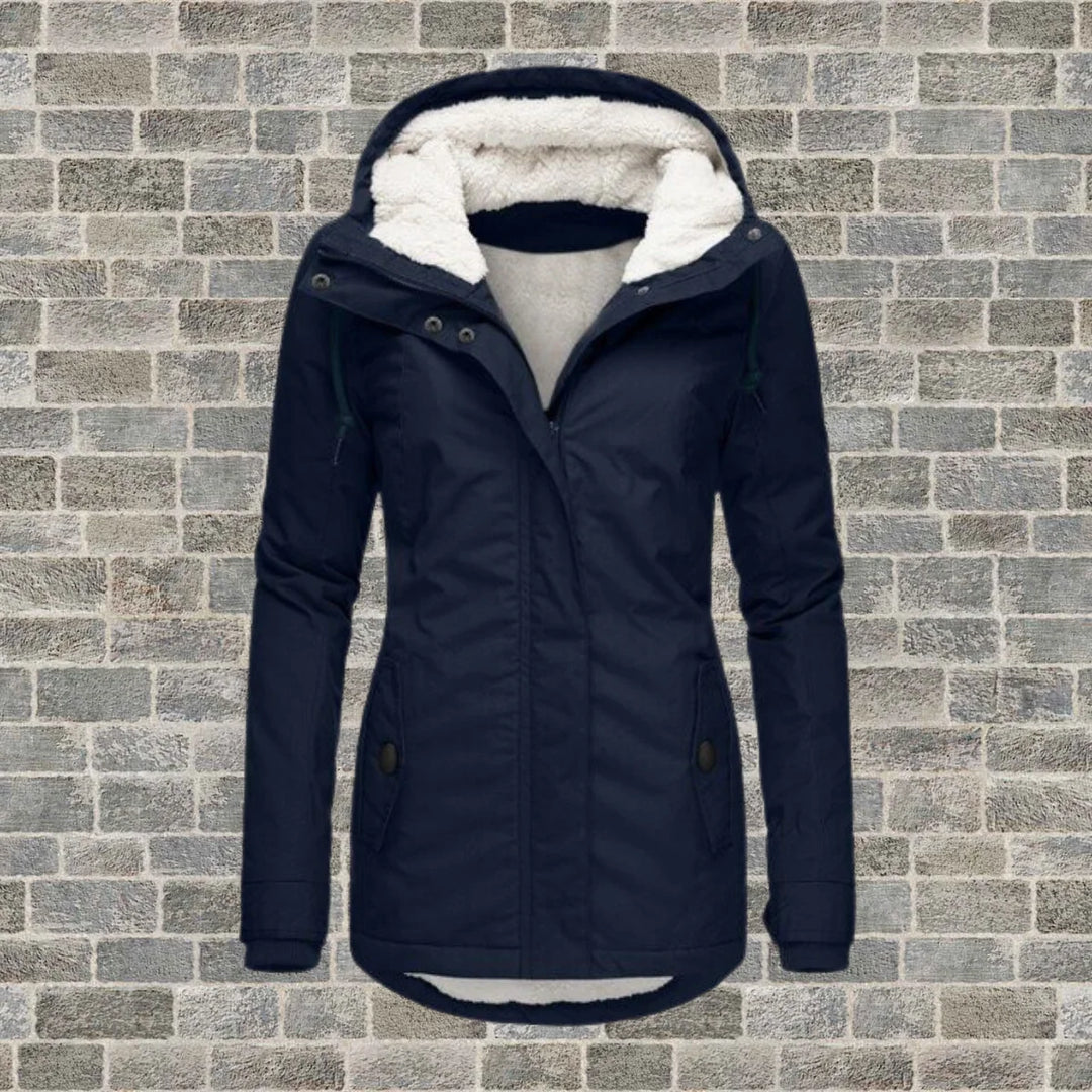 Close-up of women's parka jacket showing fleece lined hood and front zip closure