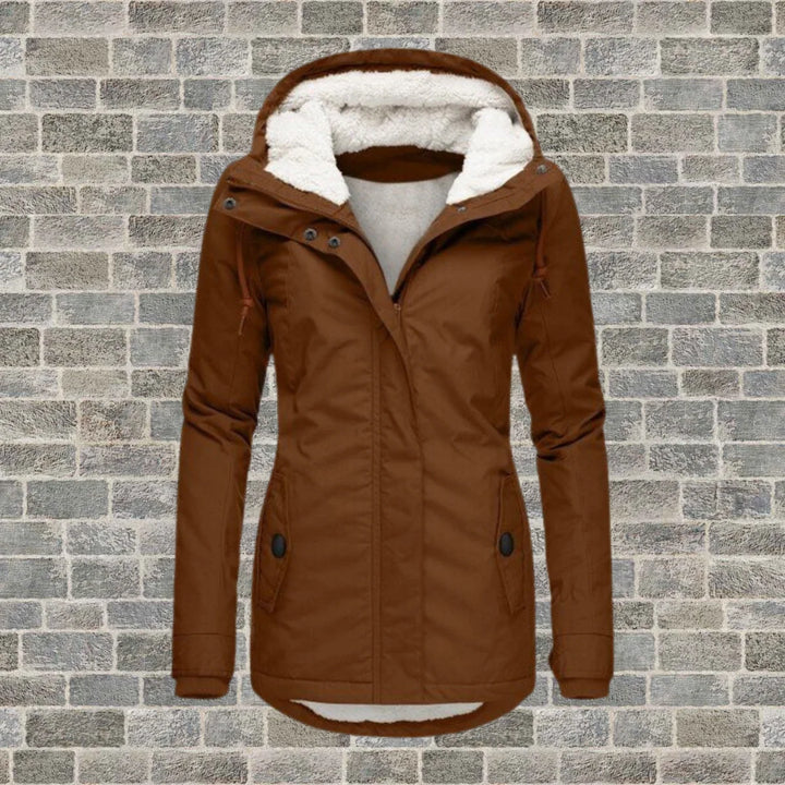 Side view of women's hooded parka with flap pockets and ribbed cuffs