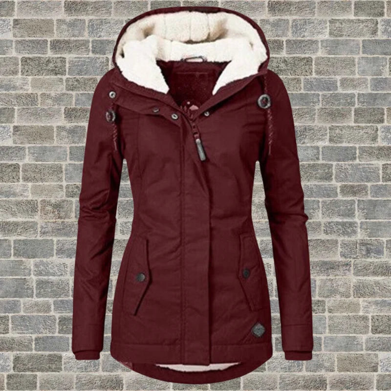 Detail of women's parka jacket drawstring hood and snap button placket